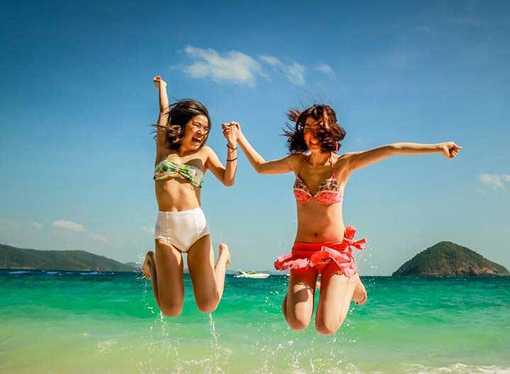 Girls on the beach during a Boat Charter sightseeing around the islands of Phuket